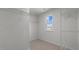 A walk in closet with a window and plenty of shelving at 200 Olive Branch St, Sanford, NC 27332