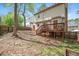 Exterior of home with a wooden deck and backyard perfect for entertaining at 202 Lighthouse Way, Cary, NC 27511