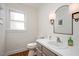 Cozy bathroom with stylish vanity, updated fixtures, and a bright window at 202 Lighthouse Way, Cary, NC 27511