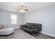 Well-lit bedroom with comfortable seating, and neutral walls at 202 Lighthouse Way, Cary, NC 27511