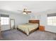Bright bedroom featuring a ceiling fan, neutral walls, and light gray carpeting at 202 Lighthouse Way, Cary, NC 27511
