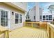 Back deck with wooden railing and steps leading to the spacious backyard at 2020 Battlewood Rd, Apex, NC 27523