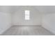 Bedroom showing neutral walls and carpeting and a window for natural light at 2020 Battlewood Rd, Apex, NC 27523