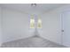 Cozy bedroom with corner windows providing natural light and fresh appeal at 2020 Battlewood Rd, Apex, NC 27523