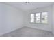 Bright bedroom with neutral carpet and natural light from the window at 2020 Battlewood Rd, Apex, NC 27523