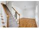 Dining room featuring hardwood floors, chandelier, and detailed wainscoting at 2020 Battlewood Rd, Apex, NC 27523