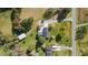 Overhead aerial view displaying the home's backyard featuring a trampoline, patio, and additional outbuilding at 206 Herronwood Dr, Graham, NC 27253