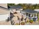 Aerial view of the backyard showing the patio, outdoor seating, grill, and screened-in porch at 206 Herronwood Dr, Graham, NC 27253
