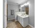 Bathroom featuring a double sink vanity, tiled floor and walk-in shower at 206 Herronwood Dr, Graham, NC 27253