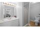 Bathroom featuring a sink, shower, and toilet with neutral finishes at 206 Herronwood Dr, Graham, NC 27253