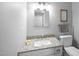 Bathroom featuring granite countertop and decorative 'Bathroom Rules' sign at 206 Herronwood Dr, Graham, NC 27253