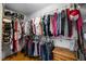 Well-organized walk-in closet with ample hanging space and shelves at 206 Herronwood Dr, Graham, NC 27253