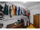 Walk-in closet features hanging racks, shelving, and a wooden chest for clothing storage at 206 Herronwood Dr, Graham, NC 27253