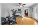 Home gym featuring an elliptical machine, treadmill, and other exercise equipment at 206 Herronwood Dr, Graham, NC 27253
