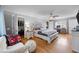 Bright primary bedroom with walk-in closet, desk, and sitting area with a view of the yard at 206 Herronwood Dr, Graham, NC 27253
