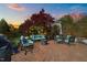 Cozy outdoor space featuring a brick patio, comfortable seating, and a decorative fire pit at 207 Grand Ave, Raleigh, NC 27606