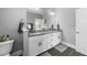 Elegant bathroom with double vanity, large mirror, and stylish fixtures at 207 Grand Ave, Raleigh, NC 27606