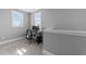 This bedroom features neutral carpet, two windows, and a desk area at 207 Grand Ave, Raleigh, NC 27606