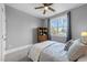 Cozy bedroom featuring a window, a dresser, and neutral walls at 207 Grand Ave, Raleigh, NC 27606
