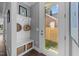 Welcoming entryway with coat rack, bench, and view of the yard at 207 Grand Ave, Raleigh, NC 27606