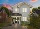 Charming two-story white farmhouse with a welcoming front porch at dusk at 207 Grand Ave, Raleigh, NC 27606
