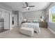 Inviting main bedroom featuring a ceiling fan, laundry access, and neutral paint at 207 Grand Ave, Raleigh, NC 27606