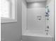 This shower stall has white subway tile and a built-in niche for toiletries at 207 Grand Ave, Raleigh, NC 27606