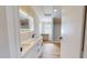 Bright bathroom features a modern vanity with dual sinks and a walk-in shower at 210 Holloway Rd, Roxboro, NC 27573