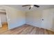 Bedroom with wood-look floors and ensuite bathroom at 210 Holloway Rd, Roxboro, NC 27573