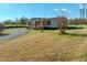 Charming single-story home with inviting front porch and gravel driveway at 210 Holloway Rd, Roxboro, NC 27573