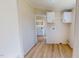 Hallway with laundry hookups and entrance to bathroom at 210 Holloway Rd, Roxboro, NC 27573