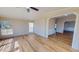 Inviting living room with wood-look flooring and abundant natural light from the windows at 210 Holloway Rd, Roxboro, NC 27573