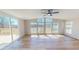 Bright living room with large windows offering scenic views and a sliding door to the outdoor deck at 210 Holloway Rd, Roxboro, NC 27573