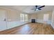 Spacious living room featuring light wood flooring, a fireplace, and natural light from the window at 210 Holloway Rd, Roxboro, NC 27573