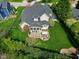 Aerial view of the backyard showing the patio, lawn, and the house's rear elevation at 213 Billingrath Turn Ln, Cary, NC 27519