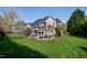 Expansive backyard featuring a patio, pergola, and lush green lawn perfect for outdoor enjoyment at 213 Billingrath Turn Ln, Cary, NC 27519