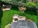 Aerial view of the backyard showing the playset, patio, and lawn area at 213 Billingrath Turn Ln, Cary, NC 27519
