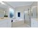 Bathroom with double vanity, tub, and a separate shower, perfect for relaxation at 213 Billingrath Turn Ln, Cary, NC 27519
