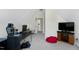 Attic bedroom features a desk, chair, entertainment center, and a beanbag for comfort at 213 Billingrath Turn Ln, Cary, NC 27519