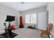Bonus room featuring exercise equipment, carpet flooring, neutral paint, and a large window at 213 Billingrath Turn Ln, Cary, NC 27519