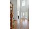 Spacious foyer with hardwood floors, a staircase, and a grand front door with glass accents at 213 Billingrath Turn Ln, Cary, NC 27519