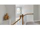 Welcoming foyer showcasing a staircase with wooden banister and a high window letting in natural light at 213 Billingrath Turn Ln, Cary, NC 27519