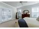 Large bedroom with carpet, furniture, and windows, perfect for relaxing and unwinding at 213 Billingrath Turn Ln, Cary, NC 27519