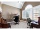 Comfortable office with large arched window, a ceiling fan, and two workstations at 213 Billingrath Turn Ln, Cary, NC 27519