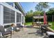 Cozy patio with comfortable seating, string lights, and a view of the well-manicured backyard at 213 Billingrath Turn Ln, Cary, NC 27519