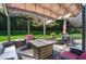 Stylish patio area with comfortable seating and a fire pit, perfect for outdoor gatherings and relaxation at 213 Billingrath Turn Ln, Cary, NC 27519