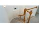 Stairwell featuring carpeted stairs and oak railing at 213 Billingrath Turn Ln, Cary, NC 27519