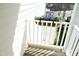 Charming balcony view featuring a beautiful flower box with colorful blooms and wooden floor at 2133 Persimmon Ridge Dr, Raleigh, NC 27604
