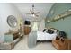 Well-lit bedroom featuring a large ceiling fan, an accent wall, and neutral decor at 2133 Persimmon Ridge Dr, Raleigh, NC 27604