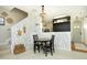Cozy dining area with modern chandelier, decorative wallpaper, and stylish furniture at 2133 Persimmon Ridge Dr, Raleigh, NC 27604